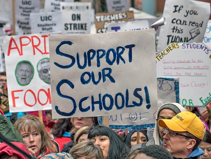 Striking teachers and community members rally to defend public education in Chicago